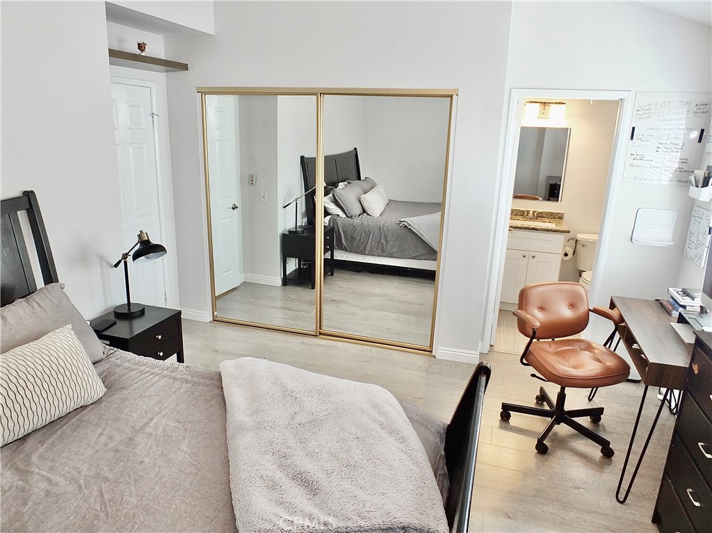 117 West Spring Street, Unit E Long Beach, CA 90806 - Photo 22 of 44 a bedroom with furniture and a chair