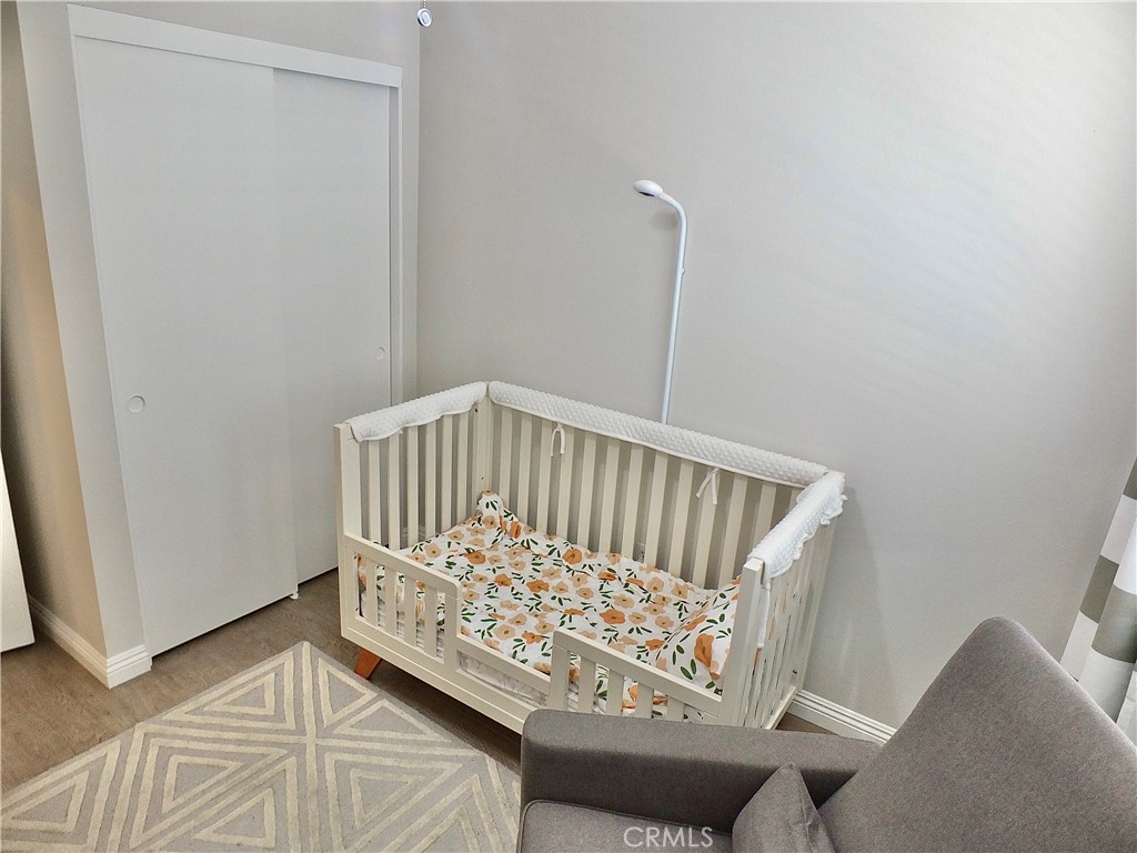 117 West Spring Street, Unit E Long Beach, CA 90806 - Photo 25 of 44 a view of wooden bedroom with furniture