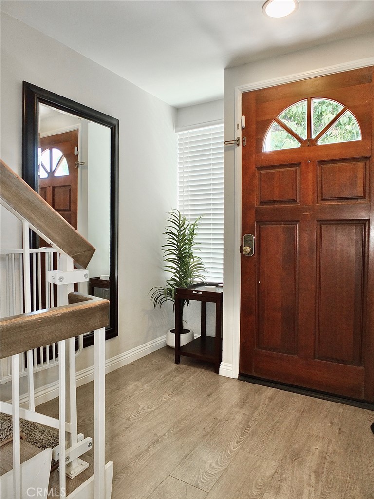 117 West Spring Street, Unit E Long Beach, CA 90806 - Photo 33 of 44 wooden floor in a livingroom with a window