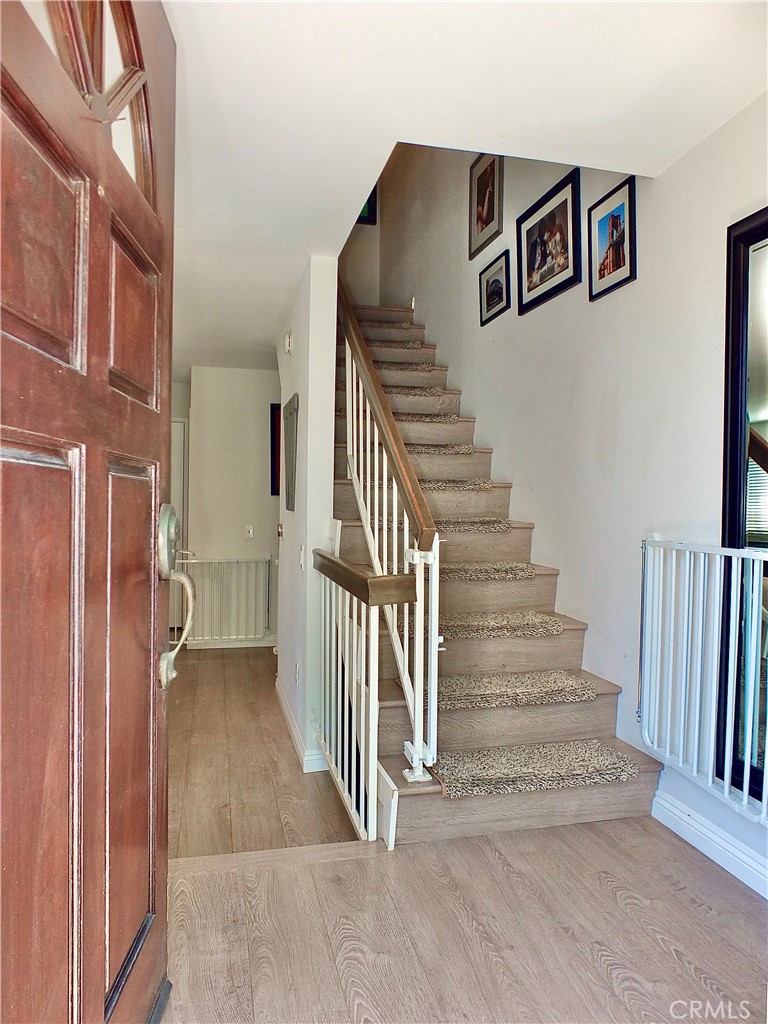 117 West Spring Street, Unit E Long Beach, CA 90806 - Photo 34 of 44 a view of a hallway with staircase
