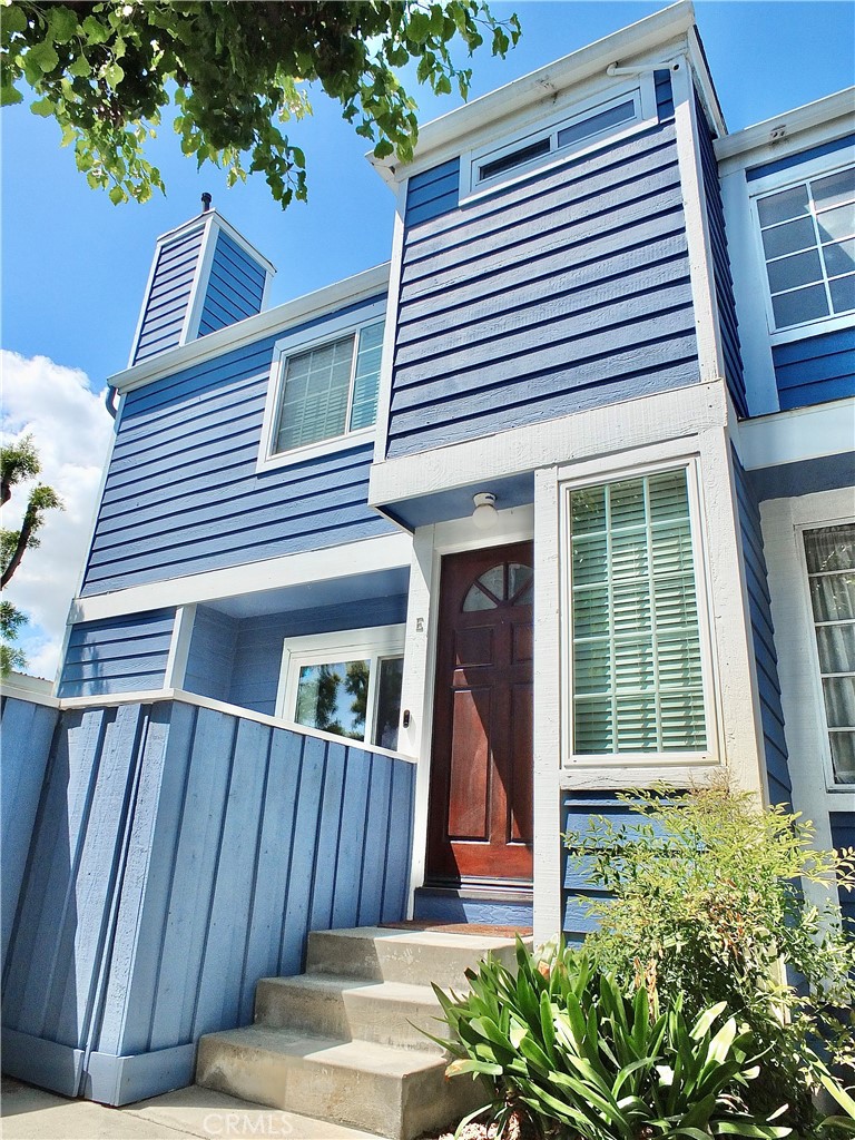 117 West Spring Street, Unit E Long Beach, CA 90806 - Photo 39 of 44 a view of a house with door and wooden fence