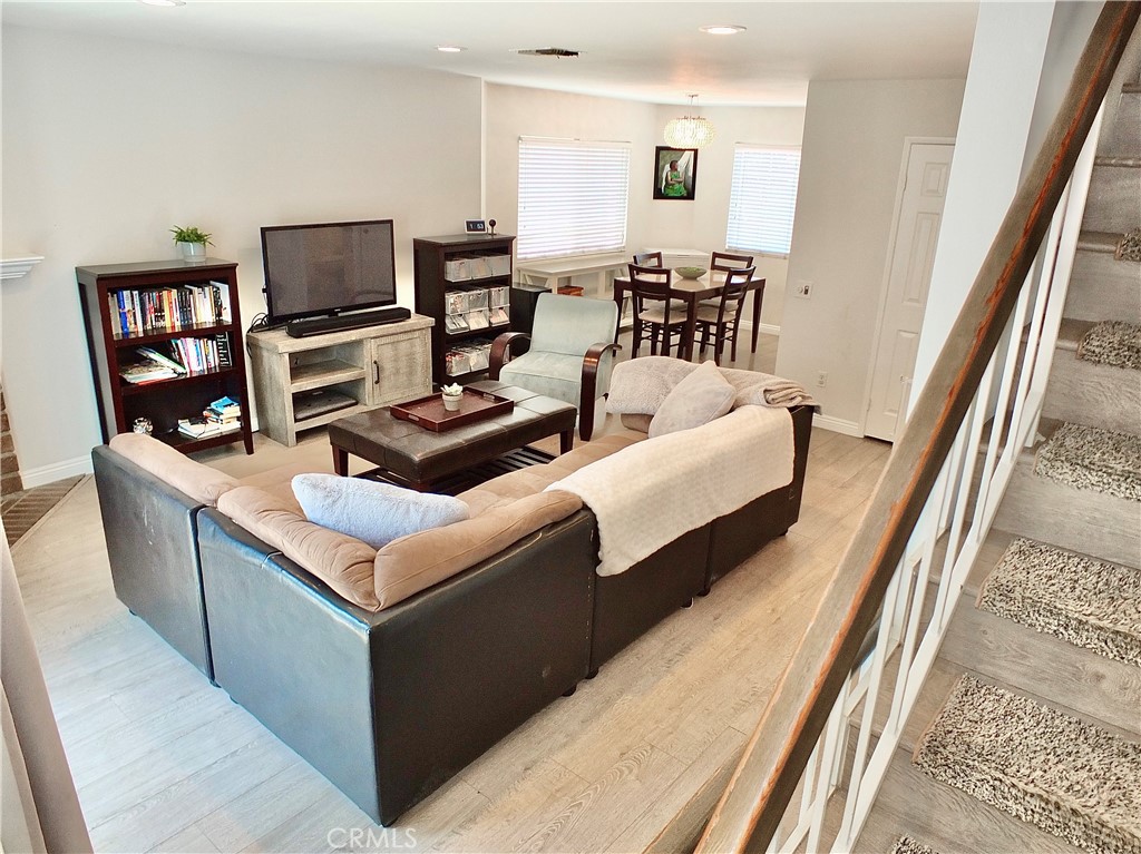 117 West Spring Street, Unit E Long Beach, CA 90806 - Photo 5 of 44 a living room with furniture and a flat screen tv