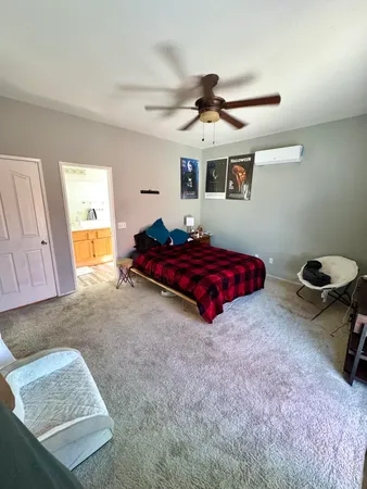a bathroom with a double vanity sink mirror and toilet