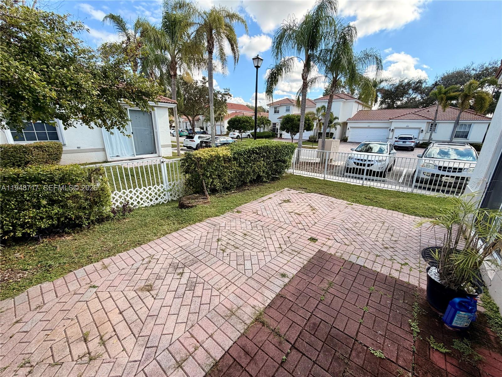 18709 Southwest 28th Street Miramar, FL 33029 - Photo 14 of 14 a view of a park with a fountain and plants