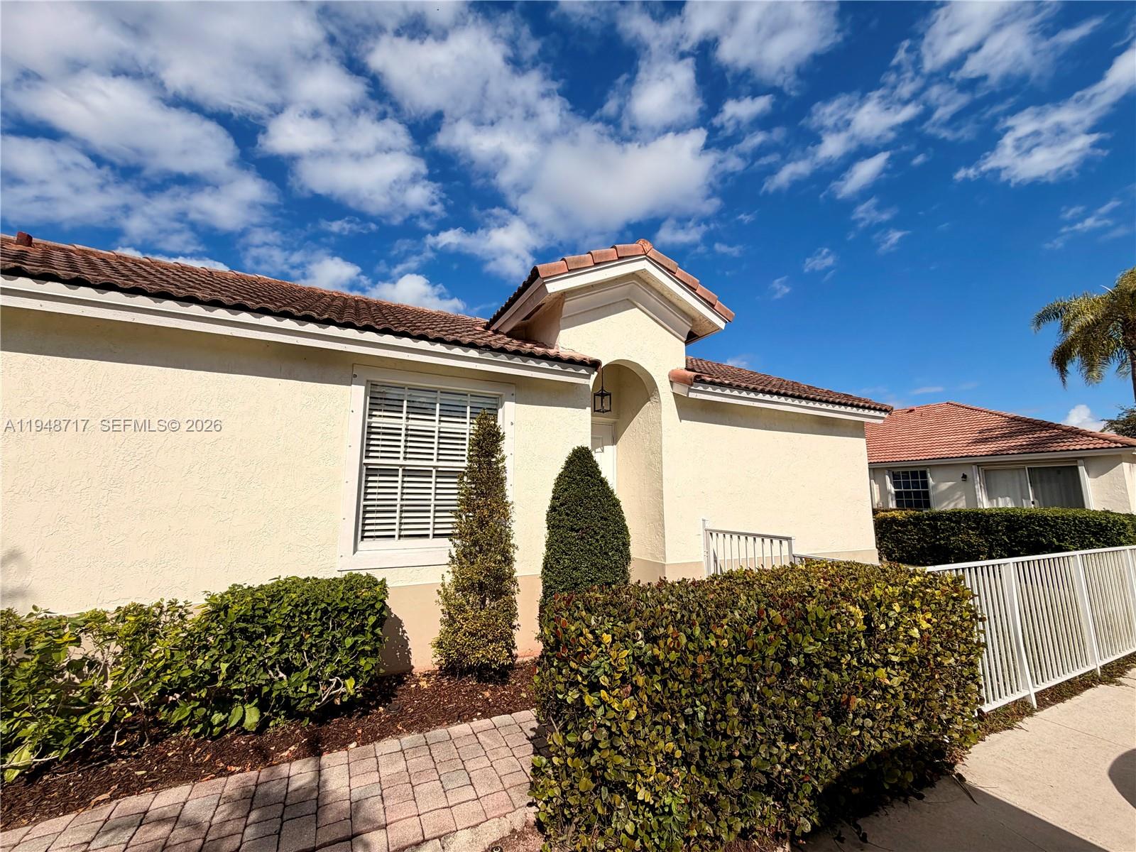 18709 Southwest 28th Street Miramar, FL 33029 - Photo 3 of 14 a front view of a house with a yard
