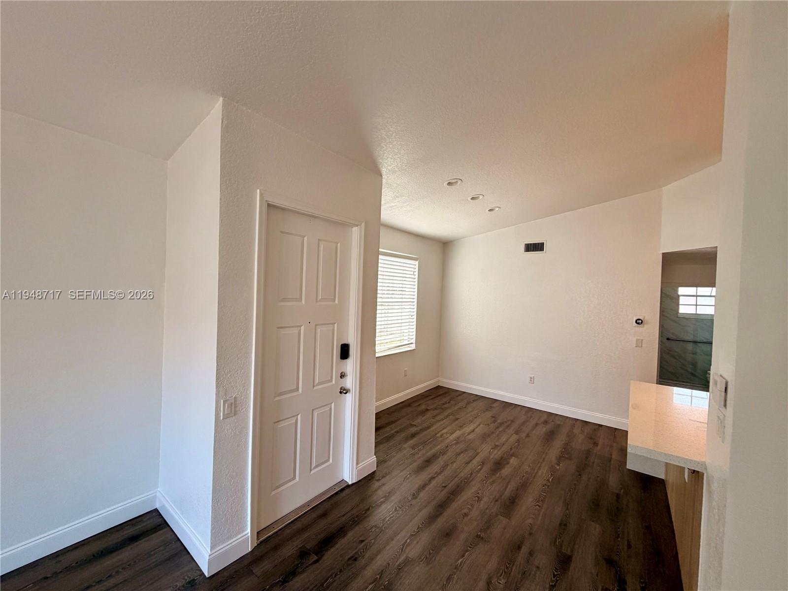 18709 Southwest 28th Street Miramar, FL 33029 - Photo 8 of 14 wooden floor in an empty room