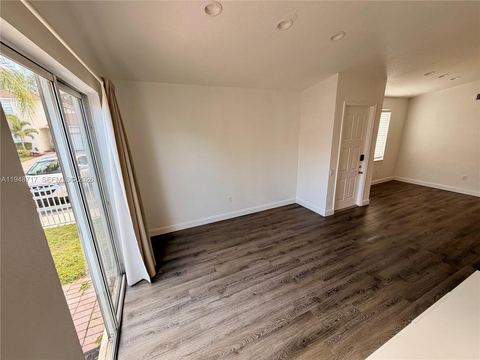 18709 Southwest 28th Street Miramar, FL 33029 - Photo 9 of 14 a view of an entryway with wooden floor