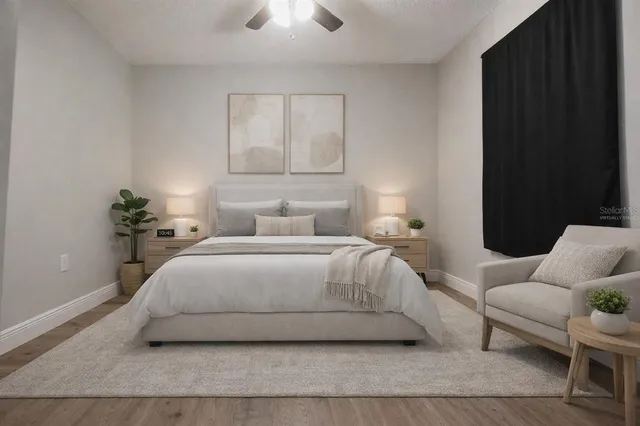 a bedroom with a bed and window