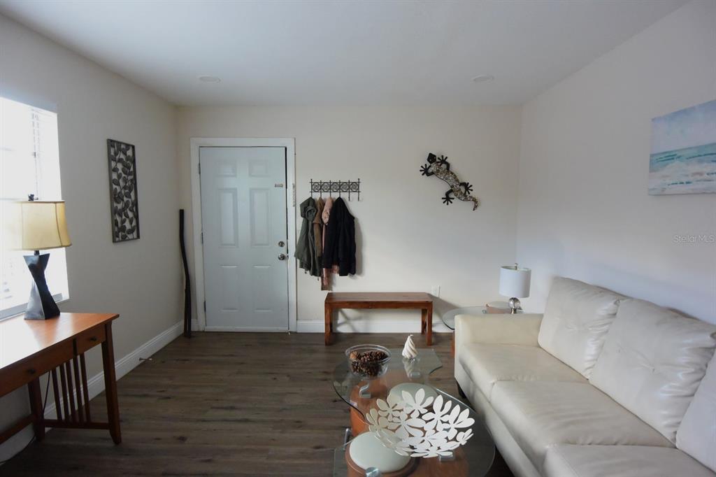 5845 Elm Street New Port Richey, FL 34652 - Photo 22 of 38 a living room with furniture and a wooden floor