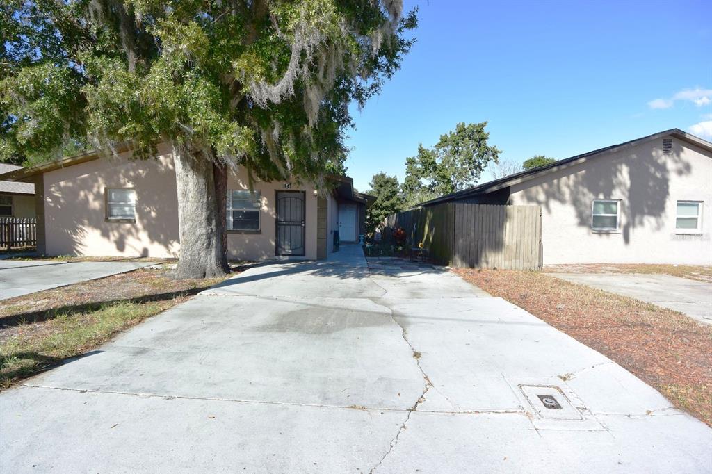 5845 Elm Street New Port Richey, FL 34652 - Photo 31 of 38 a backyard of a house with plants and trees