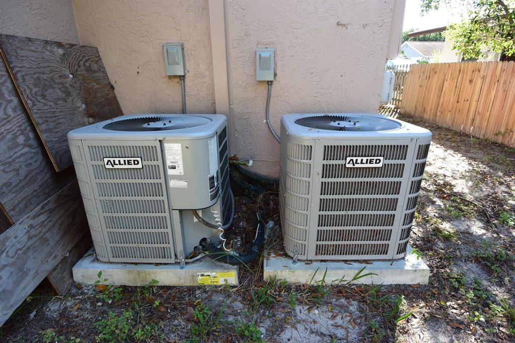 5845 Elm Street New Port Richey, FL 34652 - Photo 32 of 38 a view of a storage room with washer and dryer