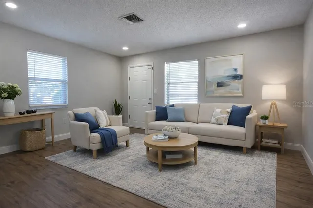 a living room with furniture and window