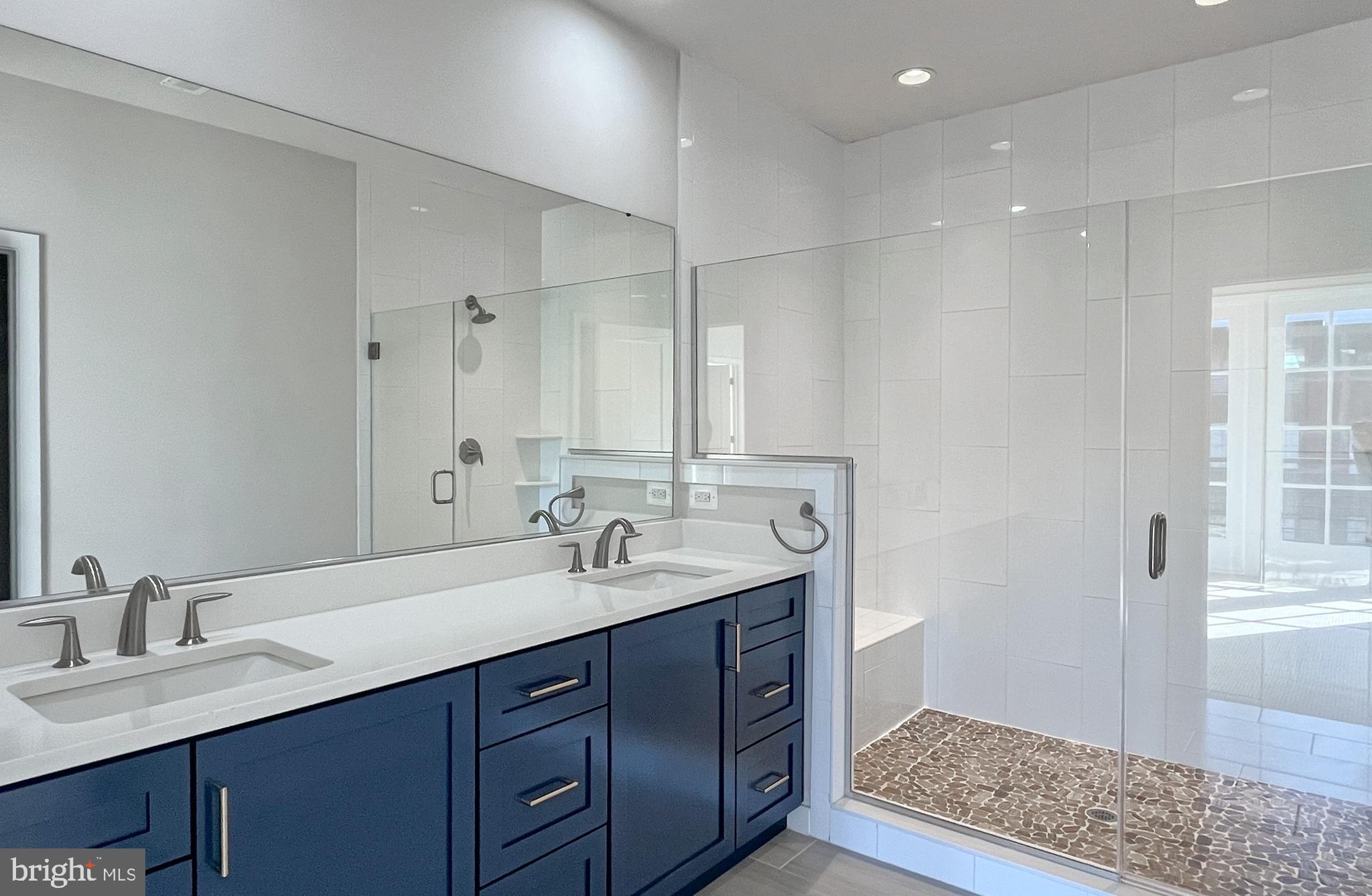 11714 Paysons Way Reston, VA 20191 - Photo 17 of 33 a bathroom with double vanity sinks and a mirror