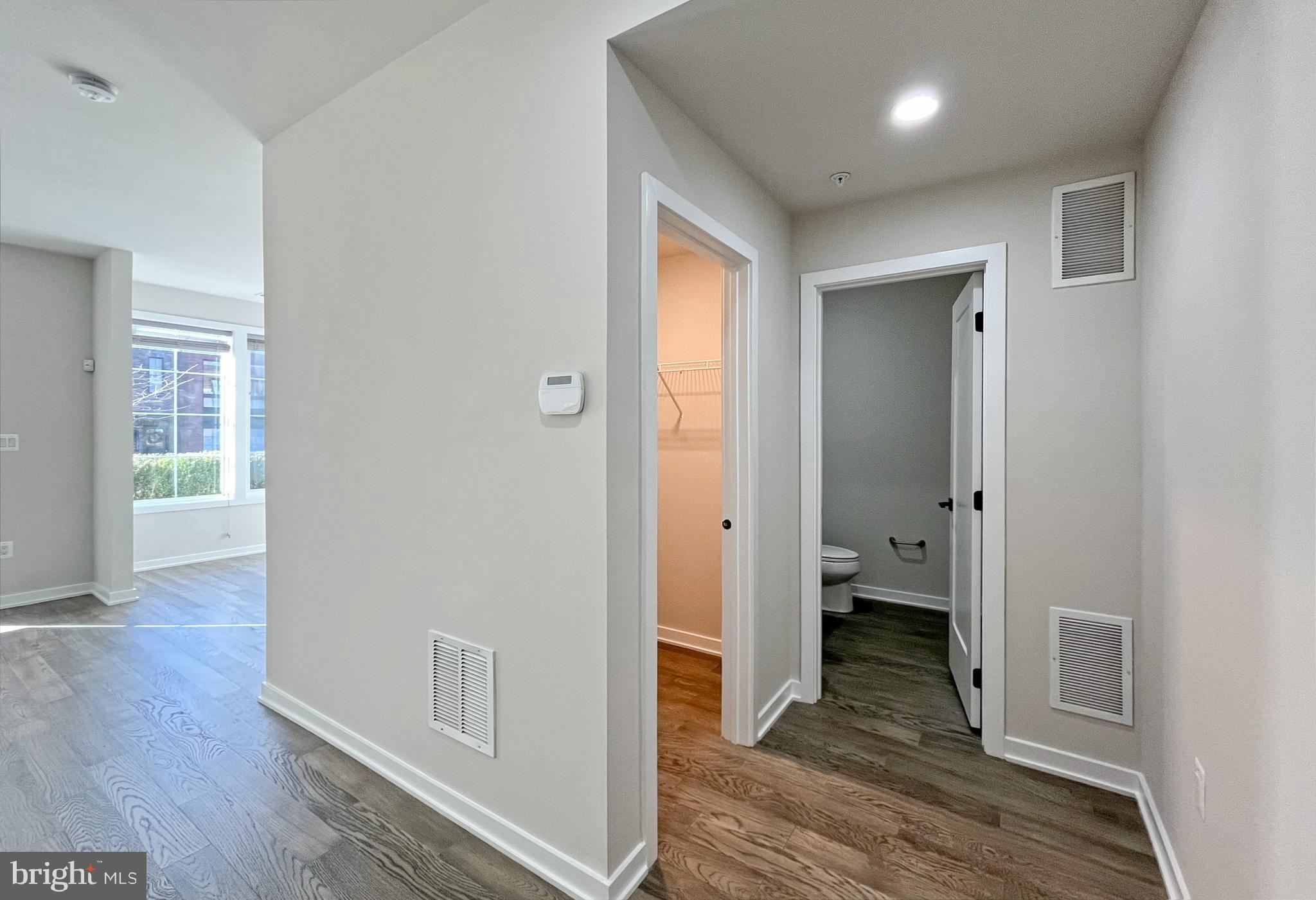 11714 Paysons Way Reston, VA 20191 - Photo 6 of 33 a view of a hallway with wooden floor and closet