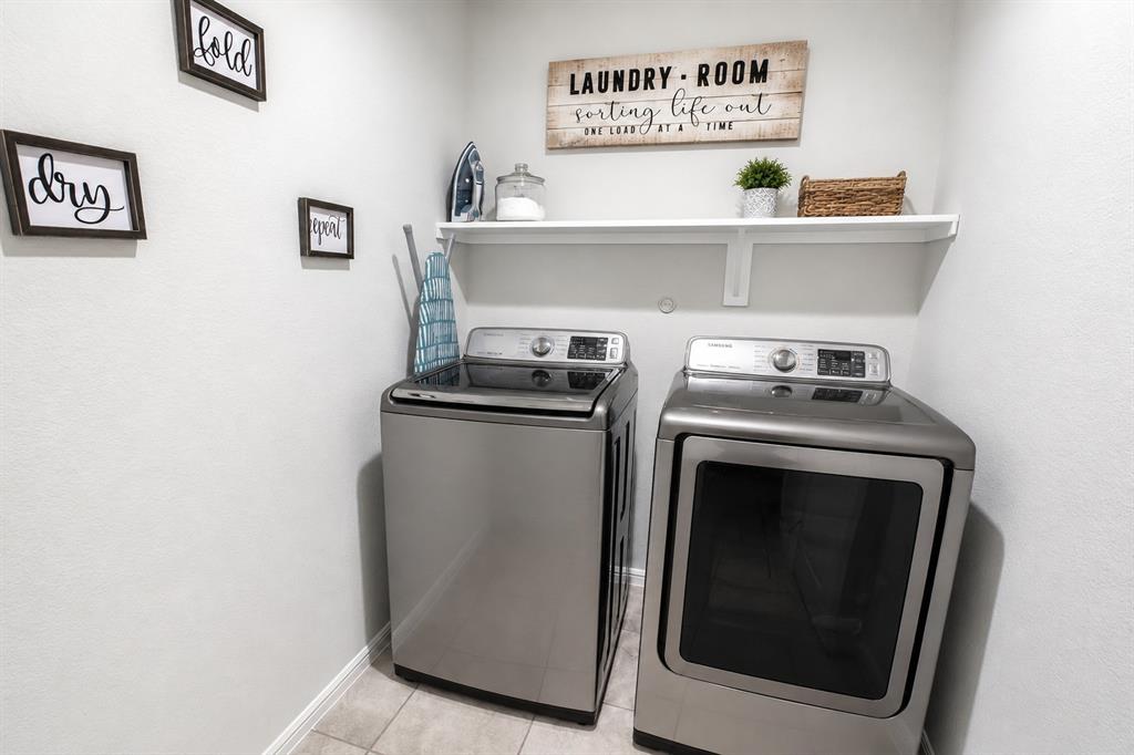 3204 Quiet Valley Road Fort Worth, TX 76123 - Photo 14 of 29 a utility room with dryer and washer