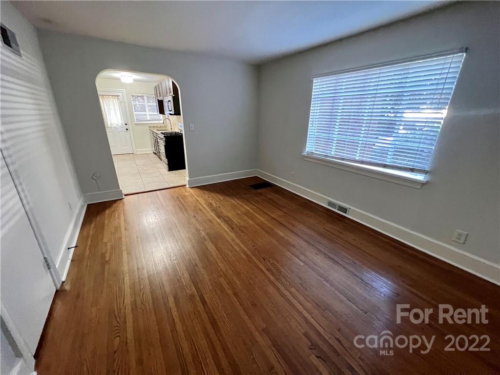 1708 Dilworth Road West, Unit 2 Charlotte, NC 28203 - Photo 3 of 8 a view of empty room with wooden floor