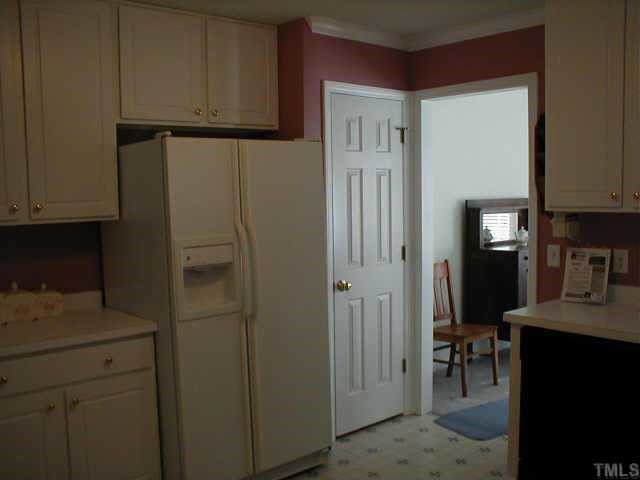 1020 Linden Crest Road Raleigh, NC 27603 - Photo 7 of 9 Kitchen also has a pantry, and office area with hardwood flooring.