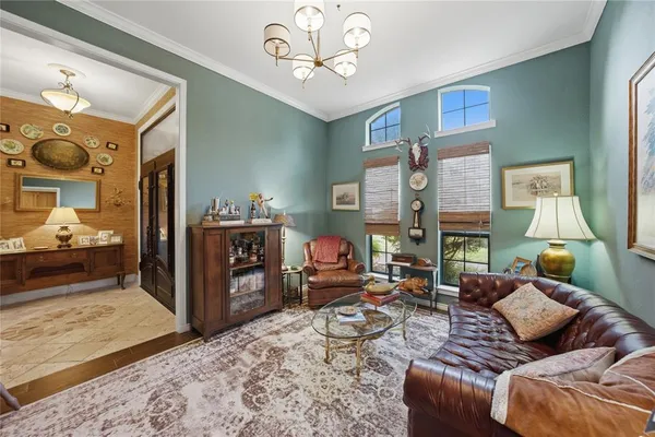 a kitchen with stainless steel appliances granite countertop a sink a stove and a wooden cabinets