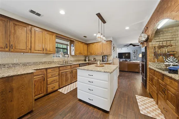 a dining room with furniture a rug and wooden floor