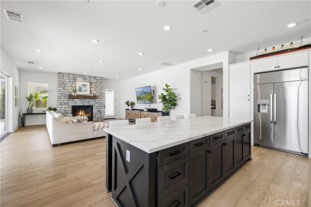 28346 Old Spgs Road Castaic, CA 91384 - Photo 13 of 69 a kitchen with kitchen island a counter top space a sink stainless steel appliances and cabinets