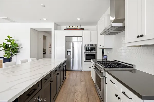 a spacious bedroom with a bed and a view of bedroom