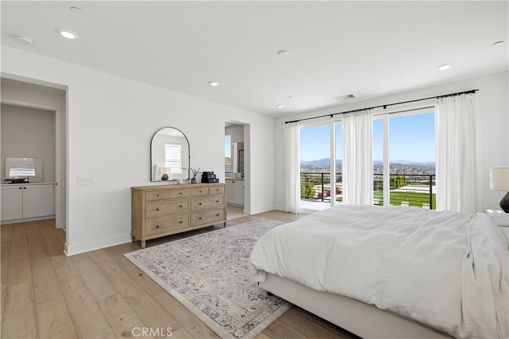 28346 Old Spgs Road Castaic, CA 91384 - Photo 19 of 69 a bedroom with a bed and a dresser