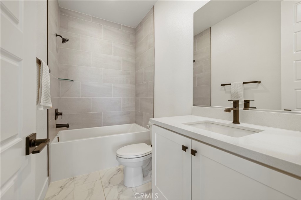 28346 Old Spgs Road Castaic, CA 91384 - Photo 29 of 80 a bathroom with a sink a toilet and shower