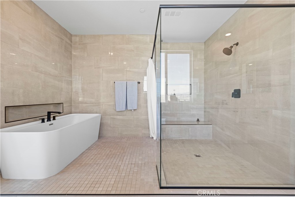 28346 Old Spgs Road Castaic, CA 91384 - Photo 30 of 80 a bathroom with a bathtub shower sink and mirror
