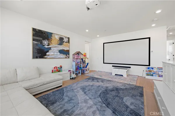 a view of a livingroom with furniture and staircase
