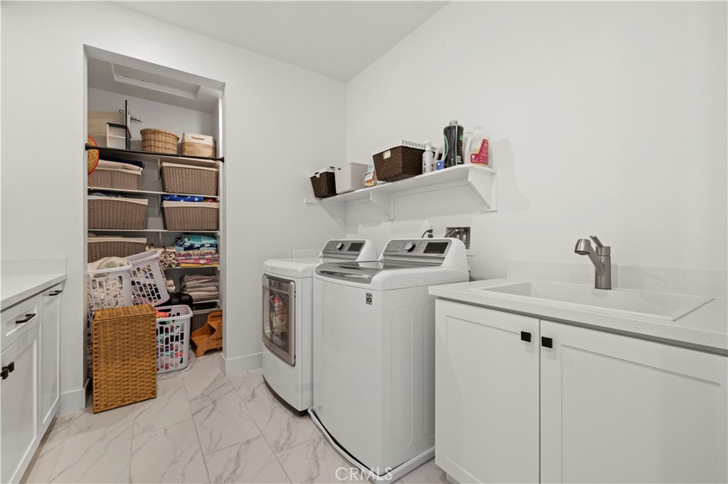 28346 Old Spgs Road Castaic, CA 91384 - Photo 37 of 69 a view of storage and utility room with two washing machine