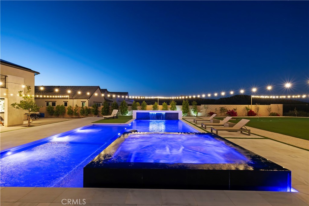 28346 Old Spgs Road Castaic, CA 91384 - Photo 50 of 69 a view of a tennis court with table and chairs
