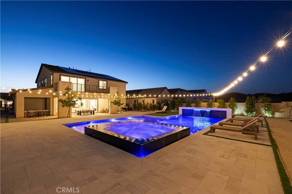 28346 Old Spgs Road Castaic, CA 91384 - Photo 58 of 80 a patio with swimming pool table and chairs