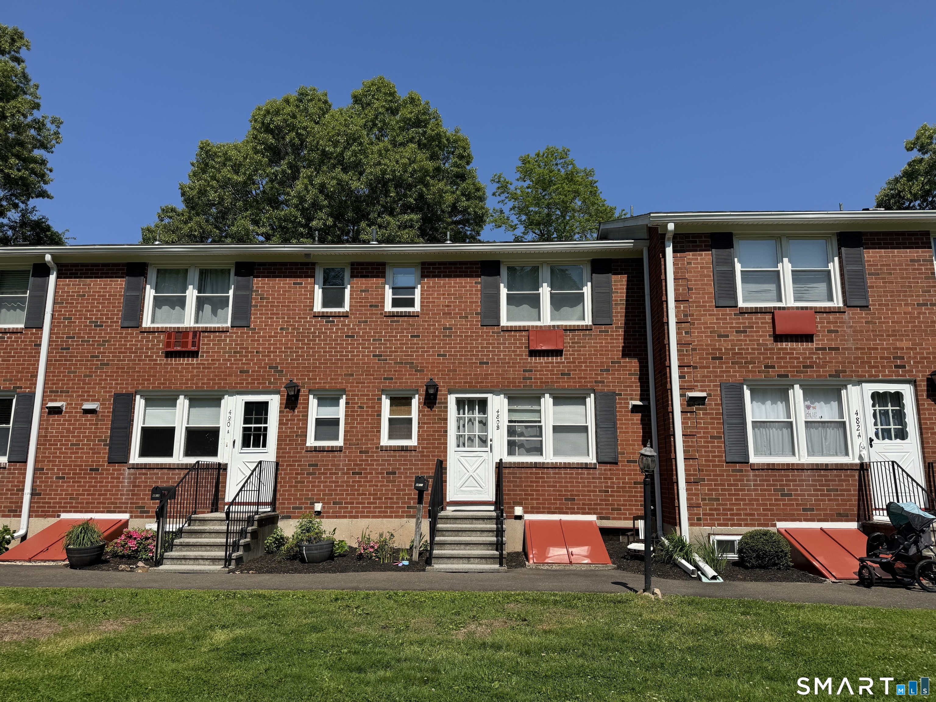 480 Radmere Road, Unit B Cheshire, CT 06410 - Photo 1 of 13 front view of a house with a yard