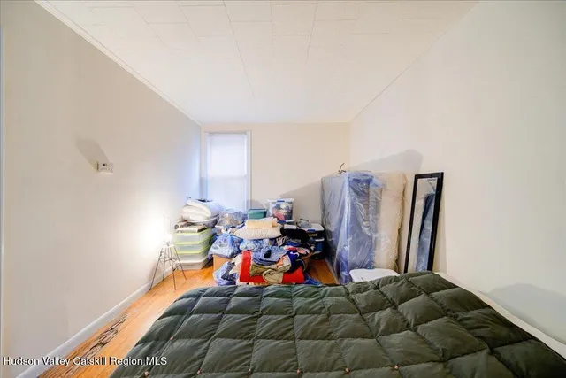 a bed room with furniture and gym equipment