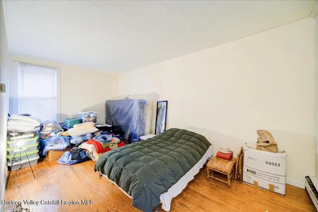 a bedroom with bed and a couch