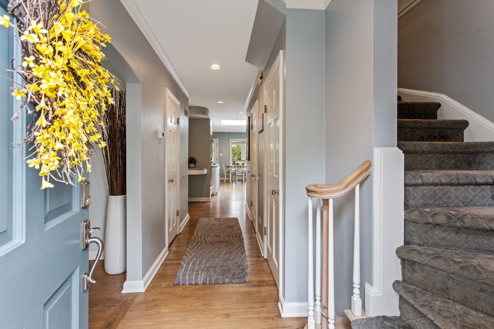 1152 Raleigh Road Glenview, IL 60025 - Photo 2 of 23 a view of a hallway with wooden floor and staircase