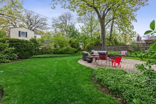 1152 Raleigh Road Glenview, IL 60025 - Photo 22 of 23 a view of a chair and table in the garden