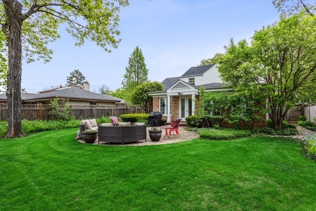 1152 Raleigh Road Glenview, IL 60025 - Photo 23 of 23 a front view of a house with a garden