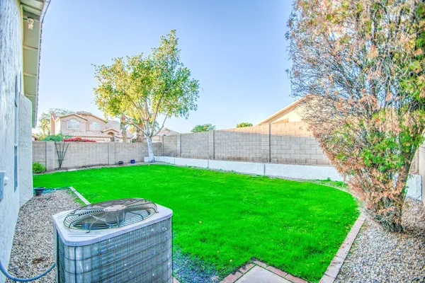 a backyard of a house with lots of green space