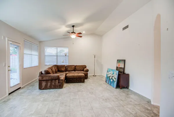 a living room with furniture and a window