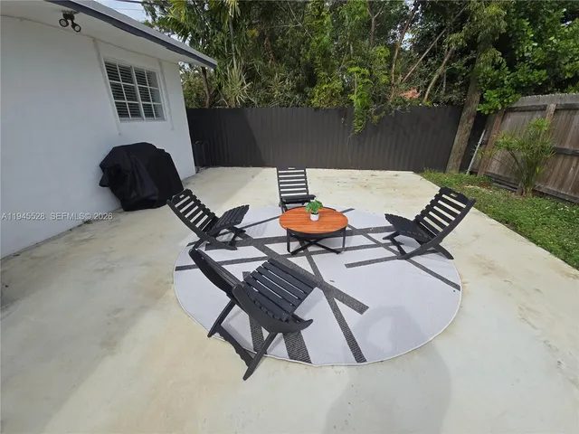 a view of backyard with furniture