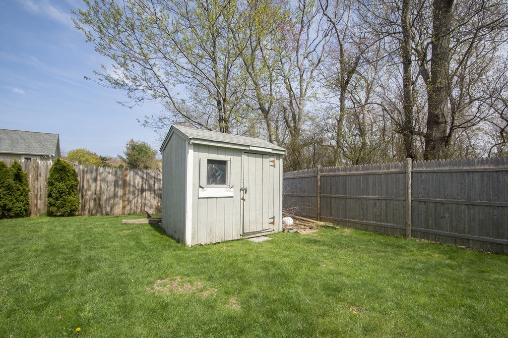 8 Seamore Road Scituate, MA 02066 - Photo 19 of 28 a view of a backyard with a large tree
