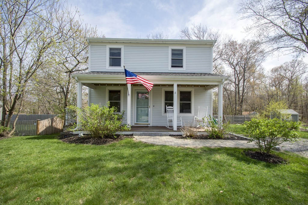 8 Seamore Road Scituate, MA 02066 - Photo 2 of 28 a front view of a house with a yard and table and chairs in a yard