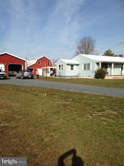 12917 Tull Road Whaleyville, MD 21872 - Photo 2 of 15 a front view of a house with a yard