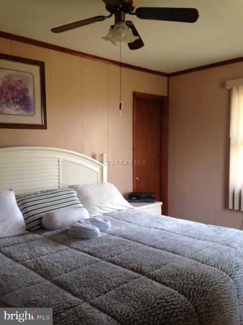 12917 Tull Road Whaleyville, MD 21872 - Photo 12 of 15 a bedroom with a bed and window