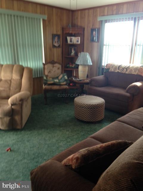 12917 Tull Road Whaleyville, MD 21872 - Photo 13 of 15 a living room with furniture and a large window