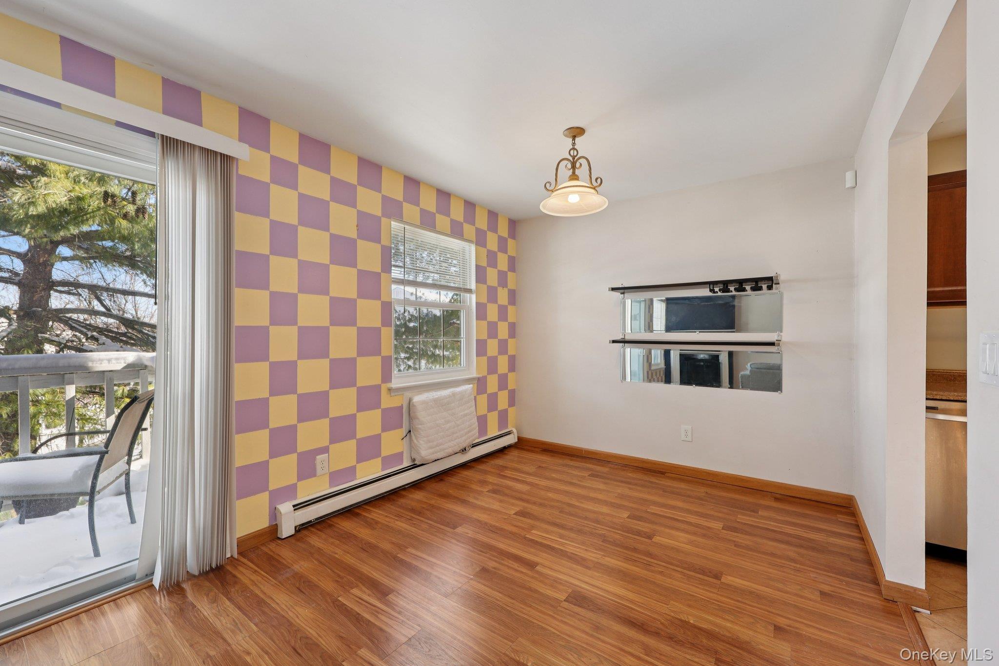 14 Lexington Hills Road, Unit 3 Harriman, NY 10926 - Photo 11 of 30 a view of empty room with wooden floor and fan