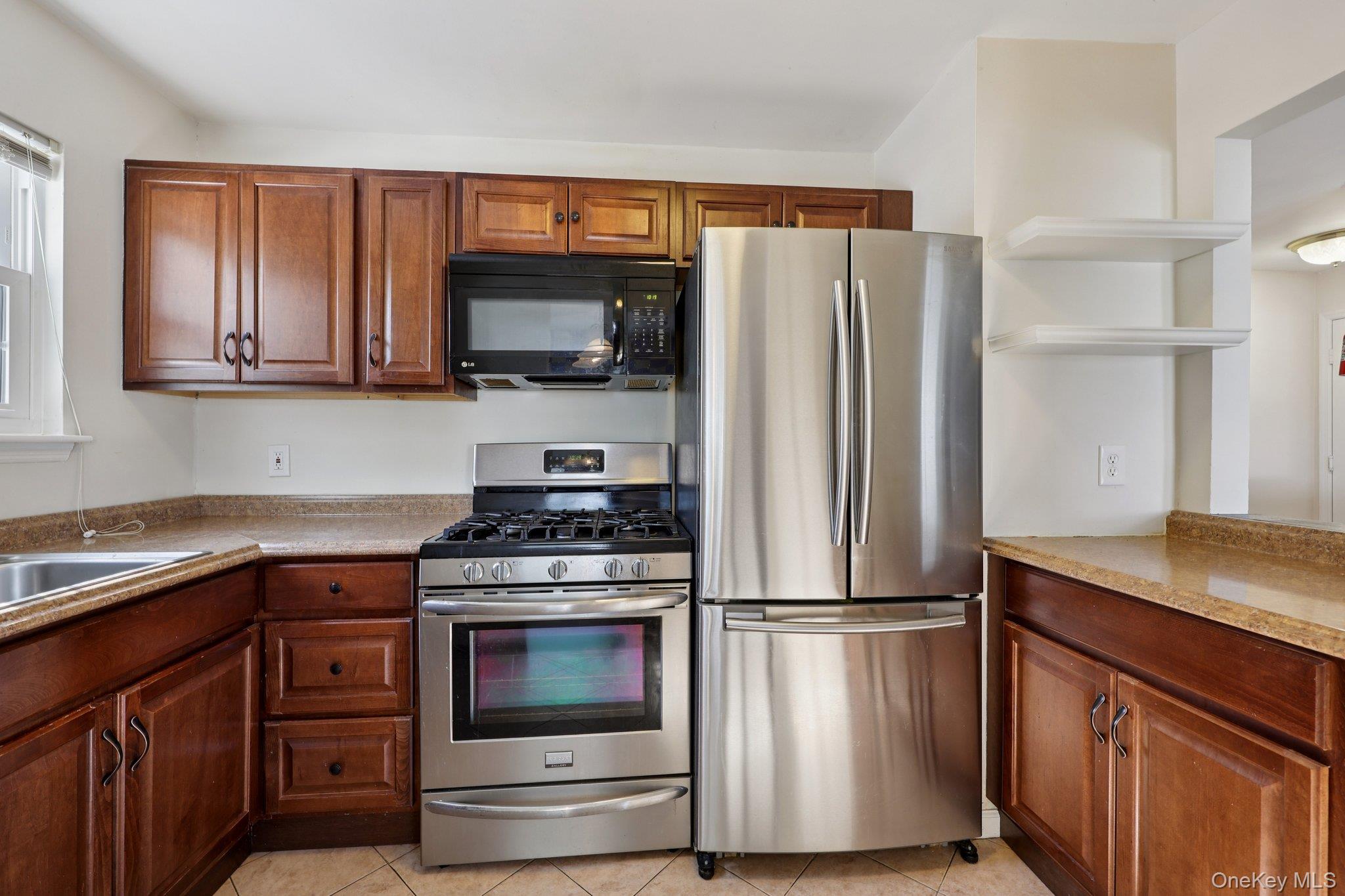 14 Lexington Hills Road, Unit 3 Harriman, NY 10926 - Photo 12 of 30 a kitchen with stainless steel appliances granite countertop a refrigerator stove and microwave