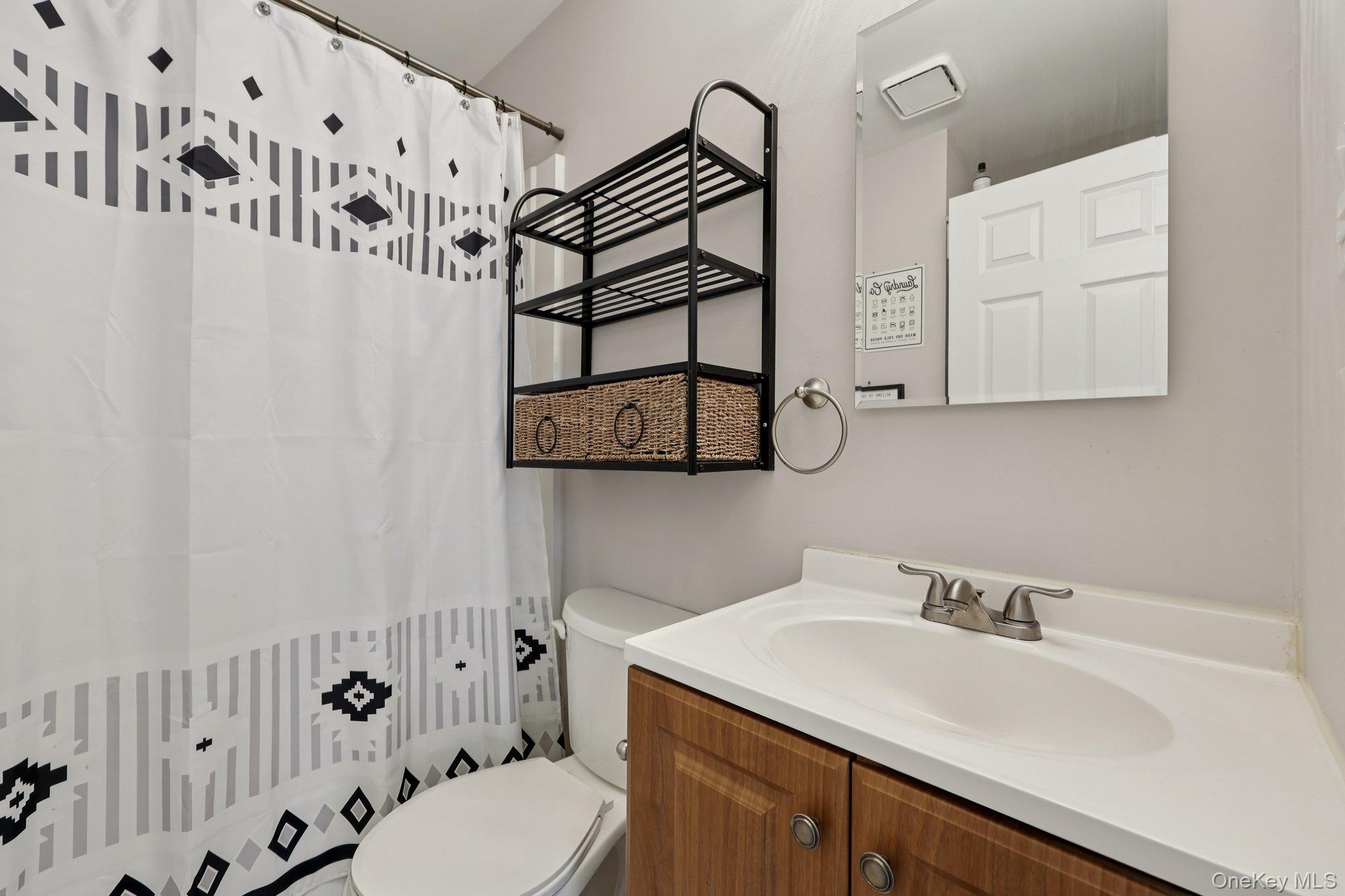 14 Lexington Hills Road, Unit 3 Harriman, NY 10926 - Photo 16 of 30 a bathroom with a sink and a mirror