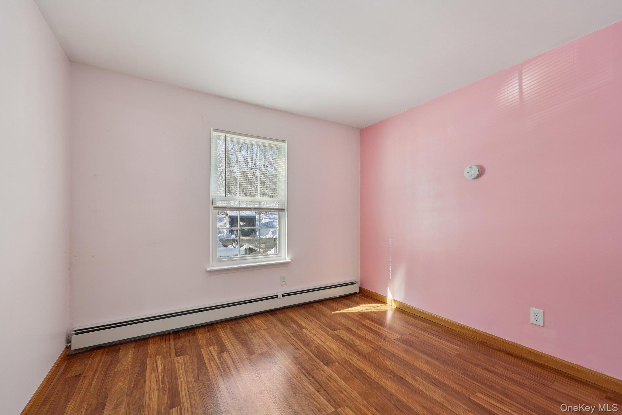 14 Lexington Hills Road, Unit 3 Harriman, NY 10926 - Photo 18 of 30 an empty room with wooden floor and windows